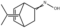 Bicyclo[2.2.1]hept-5-en-2-one, 7-(1-methylethylidene)-, oxime (9CI)