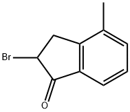 2-BROMO-2,3-DIHYDRO-4-METHYL-1H-INDEN-1-ONE